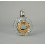 A cut glass gadget scent bottle, circa 1850, with silver screw cap and central magnifying glass, 6.
