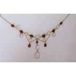 A gold, garnet and moonstone necklace,