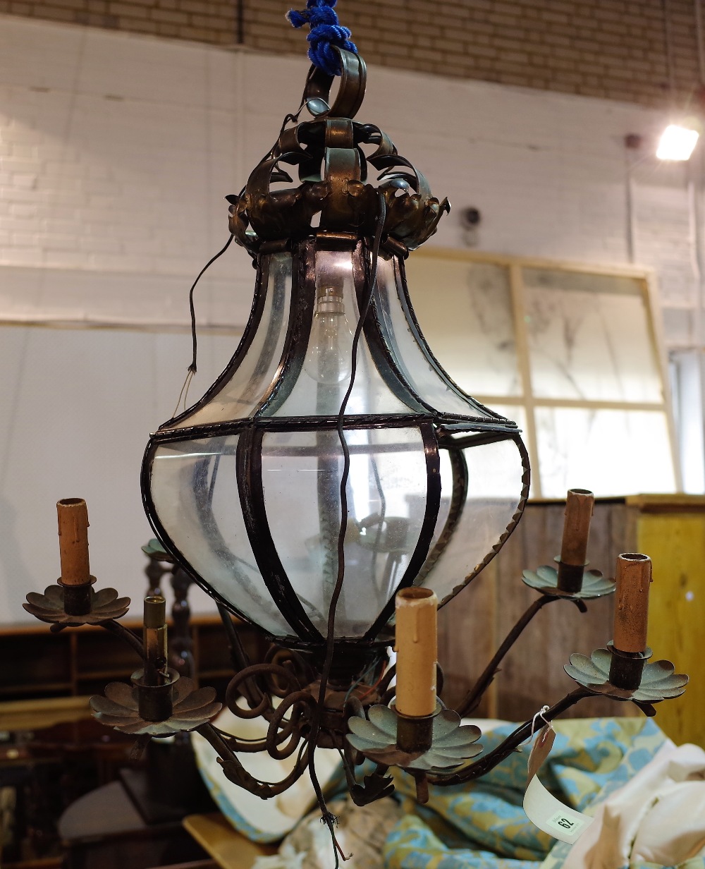 A late Victorian black painted metal six branch octagonal chandelier of tapering form,