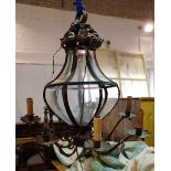 A late Victorian black painted metal six branch octagonal chandelier of tapering form,