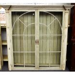 A pair of cream and green painted display cabinets,