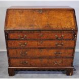 An 18th century inlaid walnut bureau, the fitted interior over four long graduated drawers,