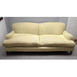 A modern green upholstered double humpback sofa on turned supports, 220cm wide x 85cm high.