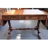 A George IV mahogany sofa table, with a pair of frieze drawers on four downswept supports,