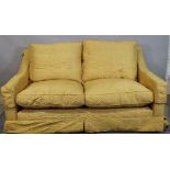 A 20th century gold upholstered sofa with downswept arms, 170cm wide x 80cm high.