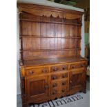 A late Victorian oak dresser with two long drawers and four short drawers,