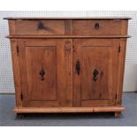 A 17th century and later Italian walnut commode with pair of drawers over pair of cupboards,