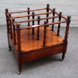 A Victorian rosewood three division Canterbury with single drawer base on turned supports,