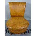 An early 20th century tan leather upholstered low chair, an Edwardian mahogany jardiniere stand,