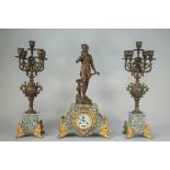 A three-piece French marble and spelter clock surmounted by a female figure titled 'Le Bouton