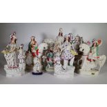 Ceramics, comprising; 19th century and later Staffordshire flat back figure groups and spill vases,