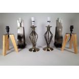 A group of three pairs of 20th century decorative table lamps, including metal and wooden examples.