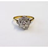 An 18ct gold and diamond set ring of cluster design,