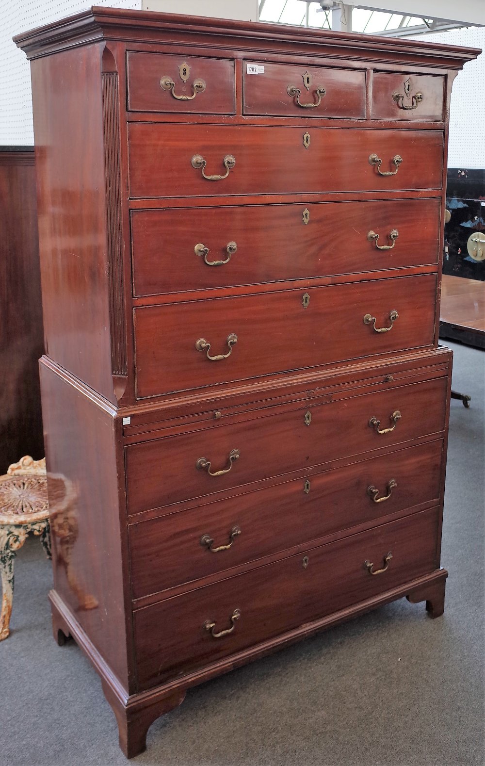 A George III mahogany chest on chest with three short over six long graduated drawers,
