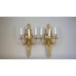 A pair of Empire style ormolu three light wall appliques, 20th century,