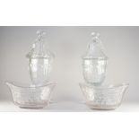 A matched pair of cut glass urns and covers, 19th century,
