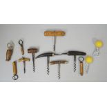 Four late 19th century direct pull corkscrews, each with horn handle,