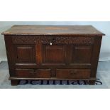 An 18th century oak mule chest, the lift top over triple panel front and pair of drawers,