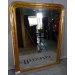 A 19th century gilt framed arched top mirror with floral chased frame, 111cm wide x 140cm high.