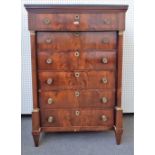 A 19th century French gilt metal mounted marble topped mahogany tall chest of six drawers flanked