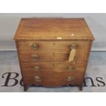 A Regency mahogany commode chest with four dummy drawers, on splayed bracket feet,