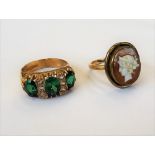 A 9ct gold, green and colourless gem set ring, Birmingham 1972, ring size O and a half,