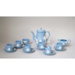 A Wedgwood blue jasper coffee set, 20th century, sprigged in white with classical figures,