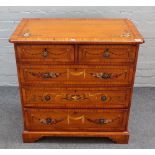 A 20th century floral polychrome painted satinwood chest,