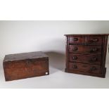 An early 20th century stained pine table top chest of two short and three long drawers,