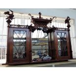 A pair of Chippendale revival mahogany hanging display shelves with pagoda tops and ho ho bird
