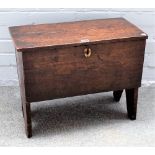 A small 17th century oak five plank coffer, on slab end supports, 54cm wide x 44cm high.