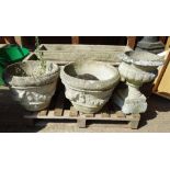 Garden statuary; a pair of 20th century reconstituted stone garden urns with swag decoration,
