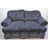 A modern two seat sofa in pattern black velvet upholstery, 165cm wide x 80cm high.