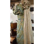 Designers Guild; a pair of lined curtains with gilt and turquoise foliate design,