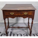 An 18th century oak single drawer side table on turned supports united by 'H' frame stretchers,