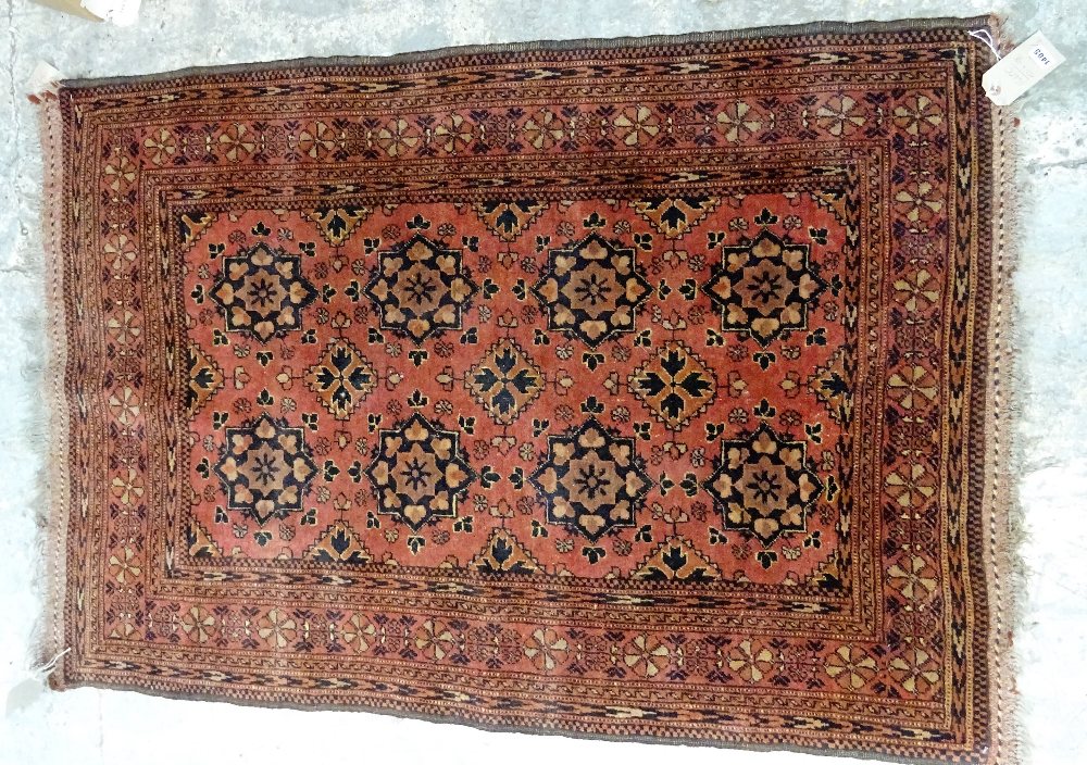 A Beshir rug, the madder field with six rows of three flowerhead guls, flowerhead border,