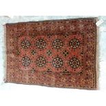 A Beshir rug, the madder field with six rows of three flowerhead guls, flowerhead border,