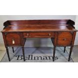 A Regency mahogany sideboard, possibly Irish, the 3/4 galleried back over drawer,