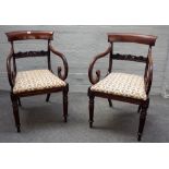 A pair of Regency mahogany carver chairs with carved waist rail, on reeded supports,
