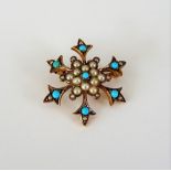 A gold, turquoise and seed pearl set brooch, designed as a six pointed star, circa 1910,