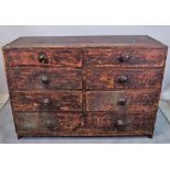 A 19th century stained pine chest with two banks of three short drawers over one long,