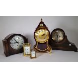 A 20th century carriage clock, another smaller and three 20th century mantel clocks, (5).