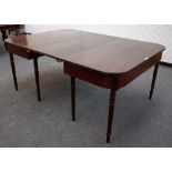 A Regency inlaid mahogany 'D' end extending dining table on turned supports, one extra leaf,