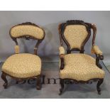 A Victorian mahogany framed open armchair on cabriole supports and another similar, (2).