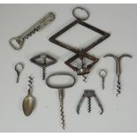 A small collection of corkscrews, including; 'The Pullezi' cantilever, a 'Commercial' straight pull,