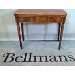 A George III mahogany card table, the 'D' shape top on turned supports, 92cm wide x 74cm high.