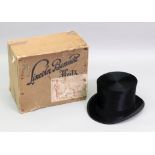 Lincoln Bennett; a black silk top hat, size 7¼, with a Lincoln Bennett Hat box, (2).