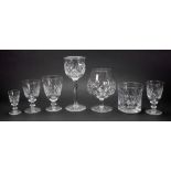 A suite of Tudor facet and diamond cut glassware, with star cut bases, 90 pieces,