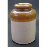 A Fulham pottery stoneware tobacco jar, impressed E T & S, 18cm high.