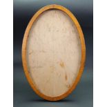 An Edwardian satinwood oval easel back photograph frame, sight size 33cm x 21cm.